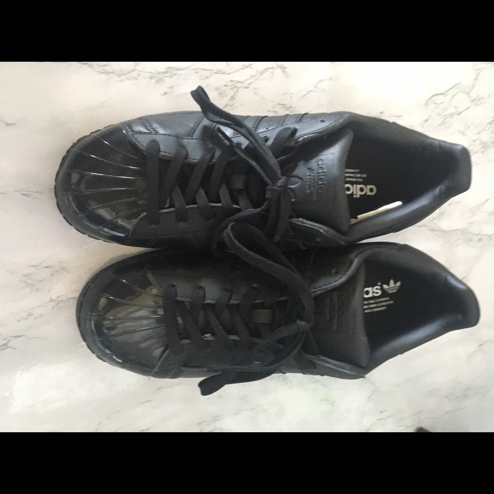 Black hard top Adidas sneakers Women’s 8.5/Men 7.5